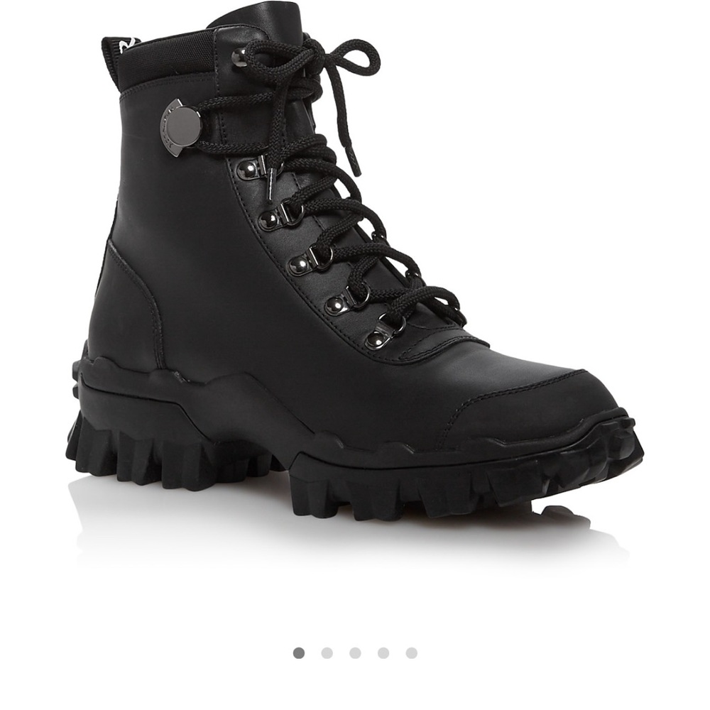 All black leather moncler boots good for hiking or winter snow conditions